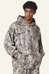 Camouflage sweatshirt with fleece lining and hood.