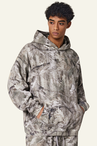 Camouflage sweatshirt with fleece lining and hood.