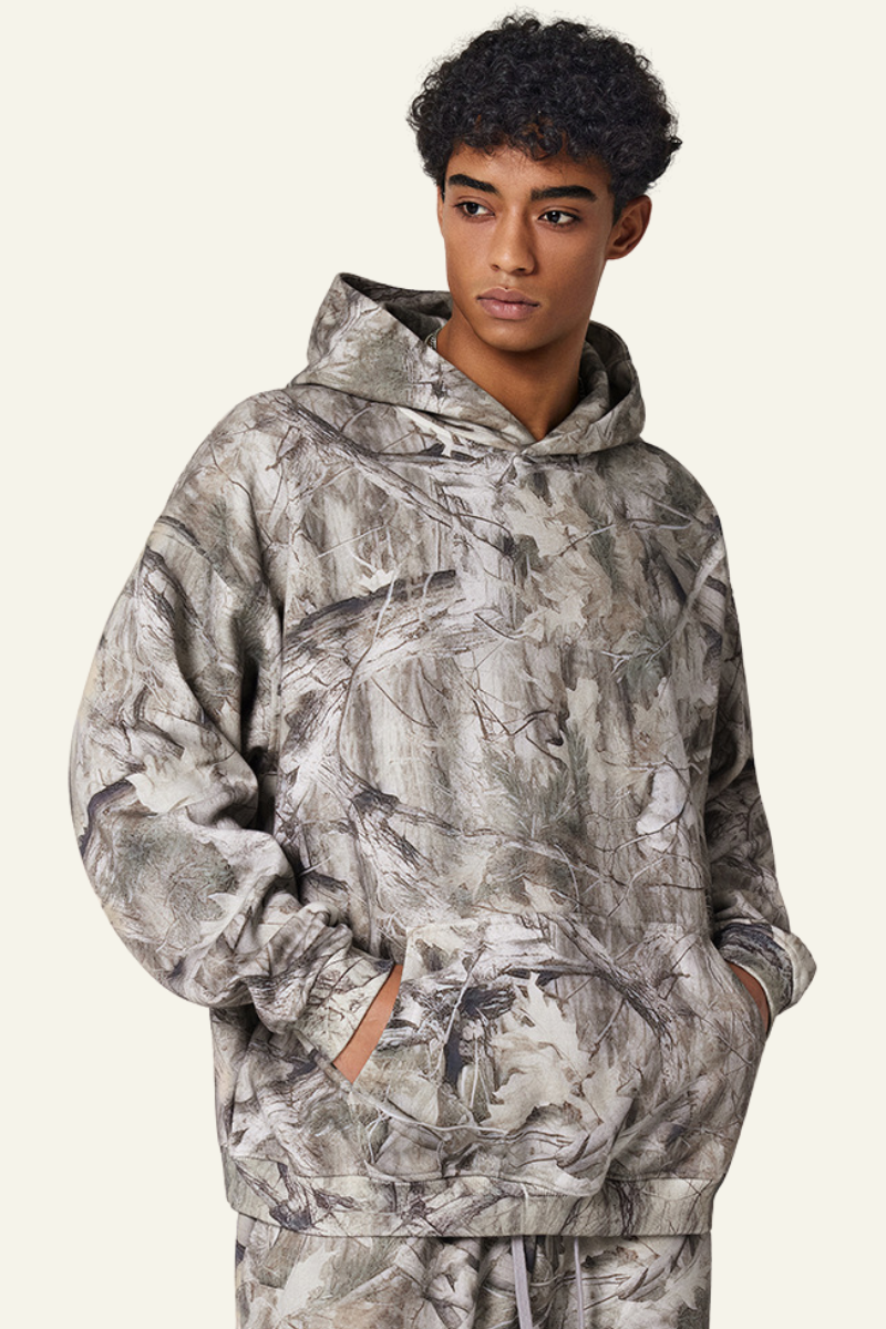 Camouflage sweatshirt with fleece lining and hood.