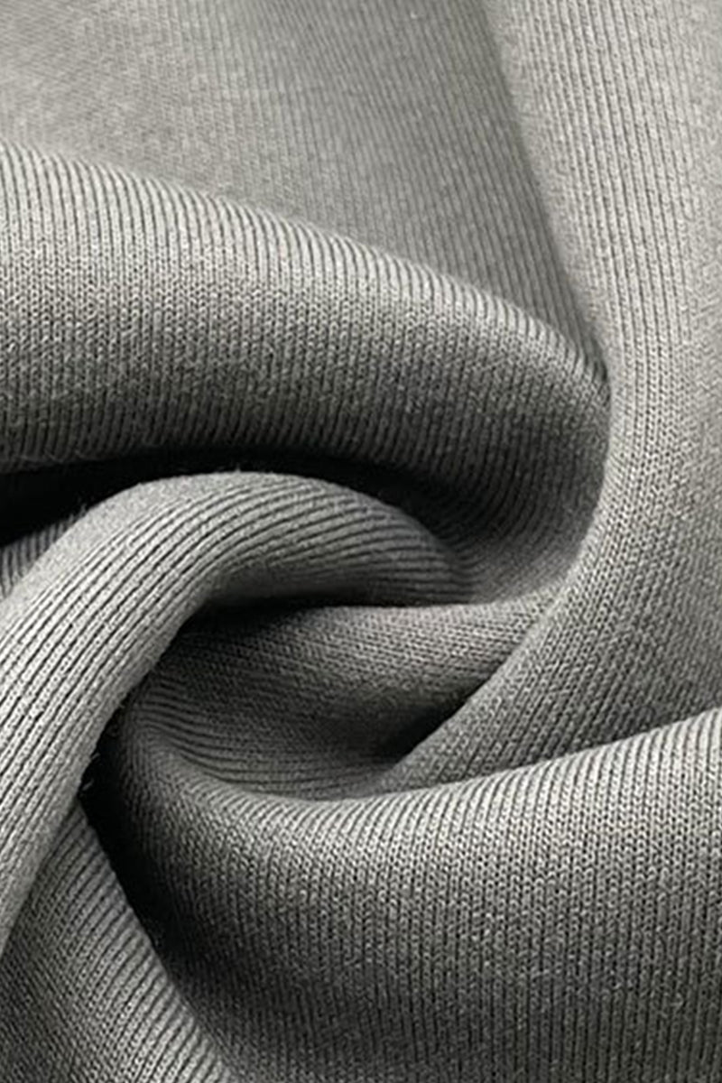 Close-up of grey sweatshirt knit fabric showing its surface and folds