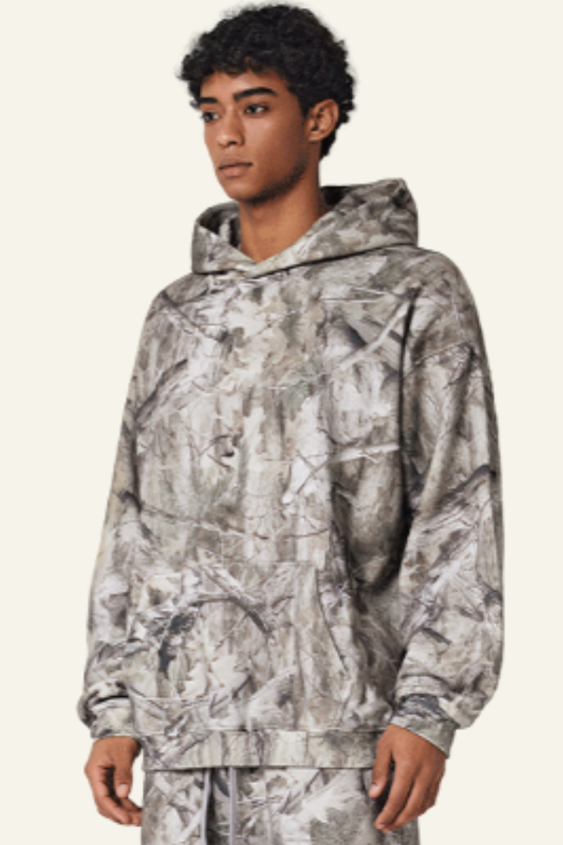 Camouflage sweatshirt with fleece lining and hood.